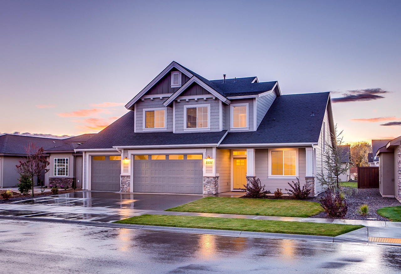 A suburban house at sunset, representing the concept of home ownership and mortgages.