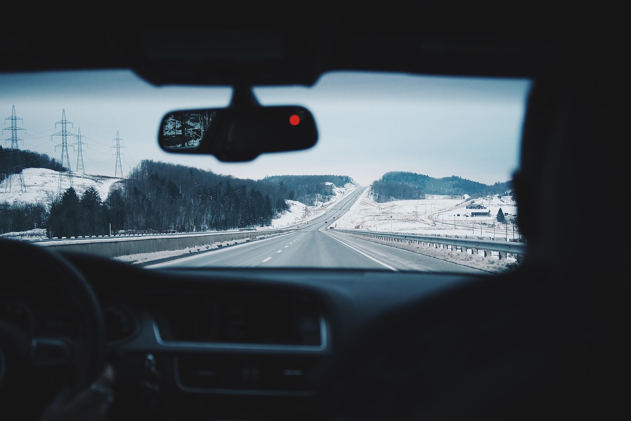 View of a road through a car windshield