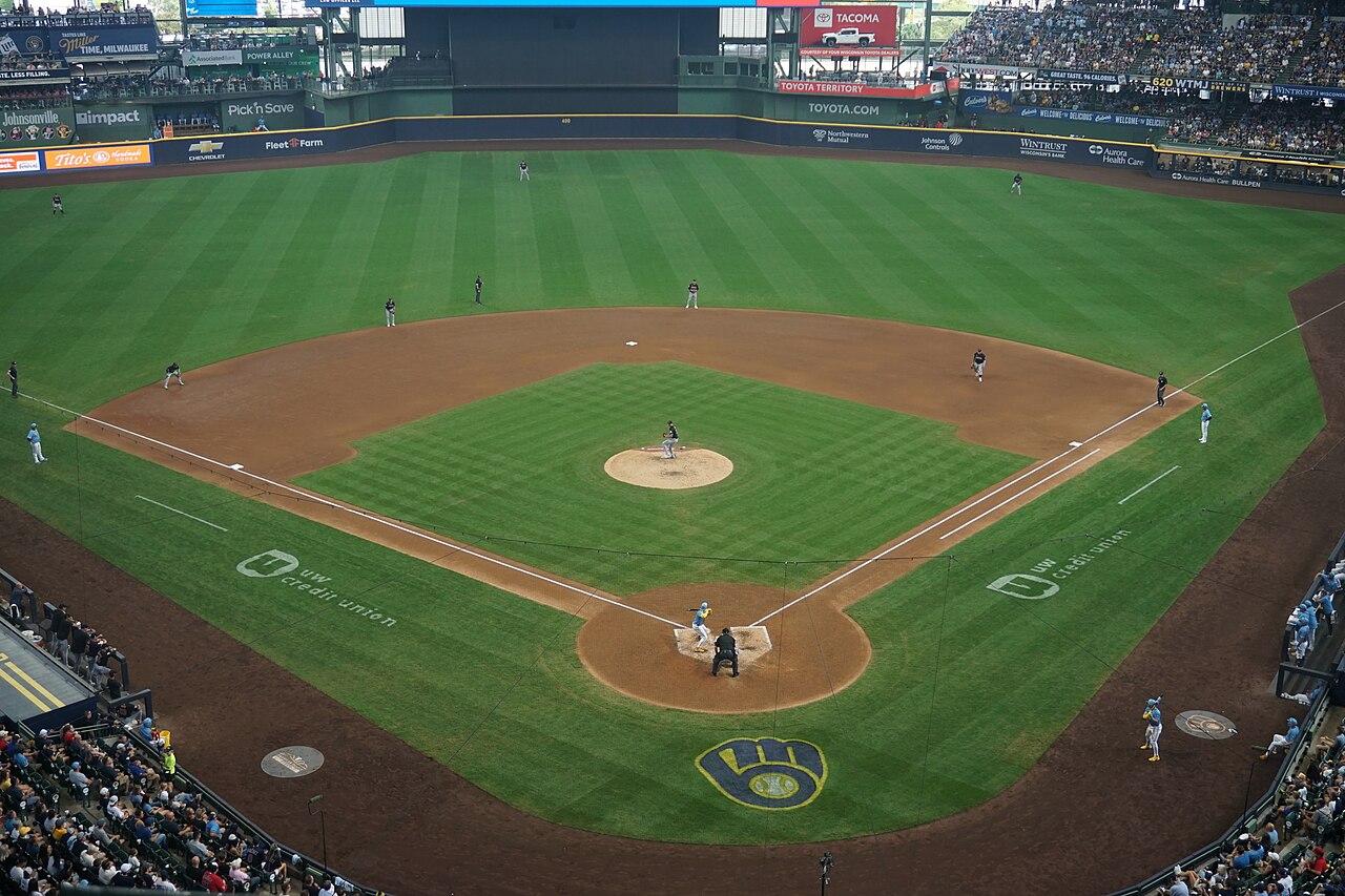 An elevated wide shot of a professional baseball stadium with players on the field during a game.